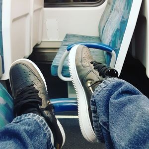 Black and gold Air Force 1s